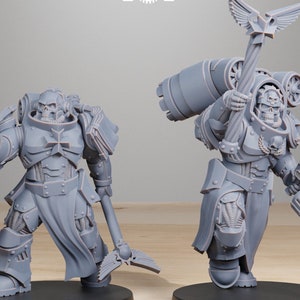 May include: Two gray miniature figurines of armored warriors, each standing on a black base. One holds a gun, the other a staff with wings. The text "STATIONFORGE" and a skull logo are in the background.