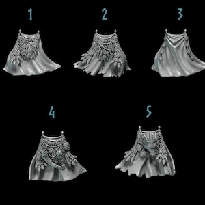 May include: Five detailed, gray miniature capes with different designs. Each cape features a draped fabric design with decorative elements such as feathers, leaves, and circular embellishments. The capes are displayed against a black background.