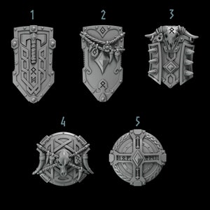 May include: Five different shield designs featuring various decorative elements, such as runes, animal skulls, and rope. The shields are all grey and have a 3D appearance.