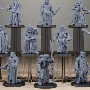 May include: A collection of gray miniature figures, each with unique attire and weaponry, standing on individual black bases. The figures are arranged on clear stands against a neutral background. The text "STATIONFORGE" and a skull logo are visible at the top.
