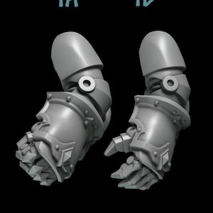 May include: Two gray plastic 3D printed miniature arms with different hand poses. The left arm is in a fist, and the right arm is in a pointing gesture. The arms are labeled 1A and 1B.