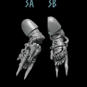 May include: Two gray 3D printed robot hands with sharp claws. The left hand has a symbol on the wrist. The right hand has a symbol on the wrist.