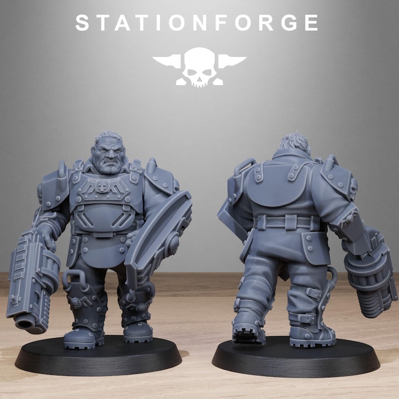 May include: A gray plastic miniature figure of a soldier wearing futuristic armor and holding a large gun. The figure is standing on a gray base.