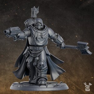 May include: A gray plastic miniature of a space marine warrior wearing a hooded cloak and holding a pistol and a power axe. The miniature is posed in a dynamic action pose.