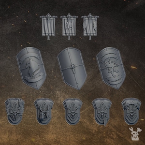 May include: A set of 3D printed miniature shields and banners featuring various designs, including a skull, a griffin, and a winged creature. The shields are gray and the banners are white.