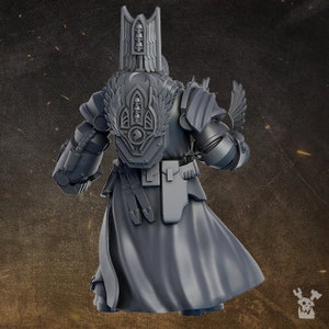 May include: A gray plastic miniature figure of a space marine wearing power armor with a winged helmet and a backpack with a skull and wings design. The figure is holding a weapon in its right hand.