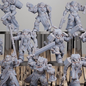 May include: A collection of gray plastic miniature figures of warriors wearing armor and holding weapons. The figures are posed in various action stances.