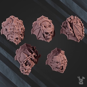 May include: Six 3D printed plastic shoulder pads for miniature figures. Each pad features a different design with a skull, bat wings, dragon, and other monstrous details.