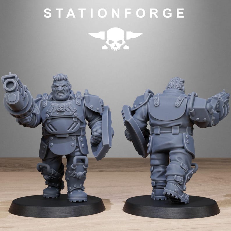 May include: Two gray plastic miniature figures of a soldier wearing armor and holding a weapon. The figure on the left is holding a large gun and a shield. The figure on the right is holding a shield and has its back to the viewer.