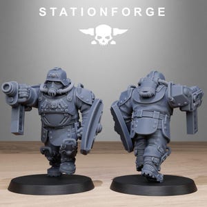 May include: Two gray plastic miniature figures of soldiers wearing futuristic armor and helmets. One figure is holding a gun and the other is holding a shield.