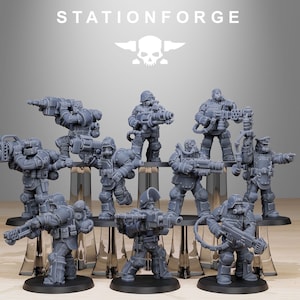 May include: A collection of gray miniature figurines of soldiers, each armed with futuristic weapons. The figurines are arranged on a clear display stand, with the word "STATIONFORGE" and a skull logo in the background.