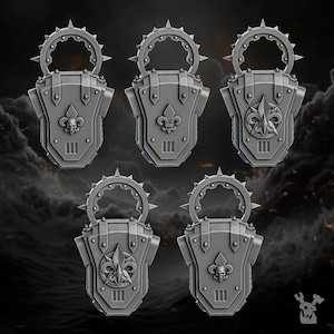 May include: Five 3D printed plastic models of a back pack with a fleur-de-lis and skull design. The back packs have a spiked halo and a ring handle.