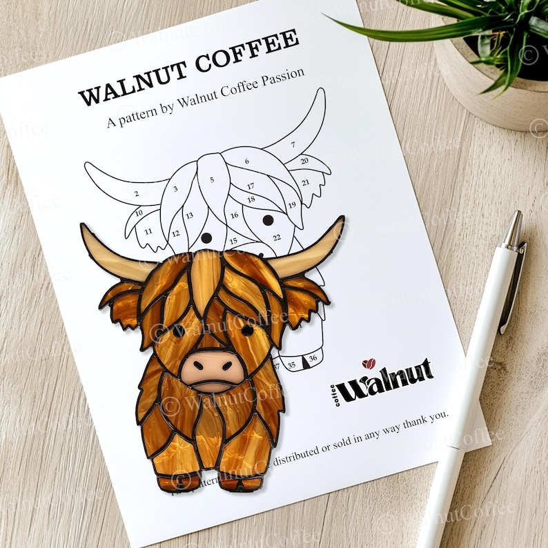 May include: A printable pattern for a stained glass craft project featuring a Highland cow with brown fur and a white face. The pattern is numbered for easy assembly. The pattern is titled "Walnut Coffee" and includes the text "A pattern by Walnut Coffee Passion".