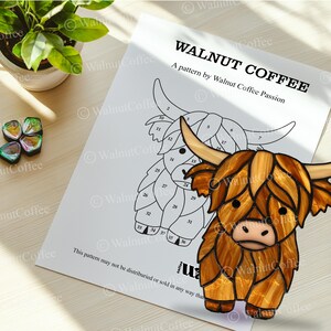 May include: A black and white line drawing of a Highland cow with numbered sections. The drawing is labeled "WALNUT COFFEE" and "A pattern by Walnut Coffee Passion".