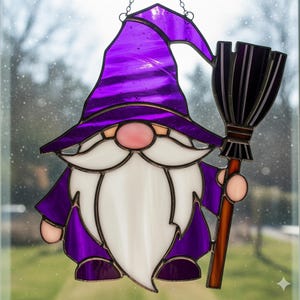 May include: Stained glass gnome with a purple hat and robe, holding a broom. The gnome has a white beard, a pink nose, and is outlined in black. The glass is translucent, allowing light to pass through. A decorative piece for Halloween or fantasy themes.