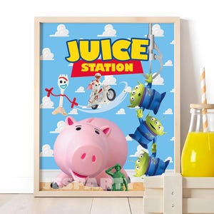 May include: A framed poster titled JUICE STATION featuring a light blue background with white clouds. Characters include a white spork, a white motorcycle, a pink pig, a green soldier, and three green aliens being lifted by a metal claw.