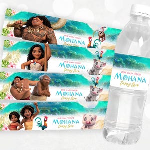 May include: Water bottle labels featuring characters from the animated movie Moana. The labels are blue and green with images of Moana, Maui, and Pua. The text on the labels reads "Our Waifinder Moana Turns Two".