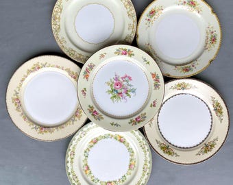 Mismatched vintage dinner plates from Japan, Meito China, Noritake and Royal China. Priced individually
