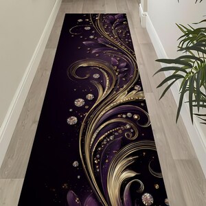 May include: A long rectangular runner rug featuring a deep purple and black background with flowing gold filigree swirls and scattered circular diamond-like accents. The design creates a continuous pattern of metallic gold lines and purple petals.