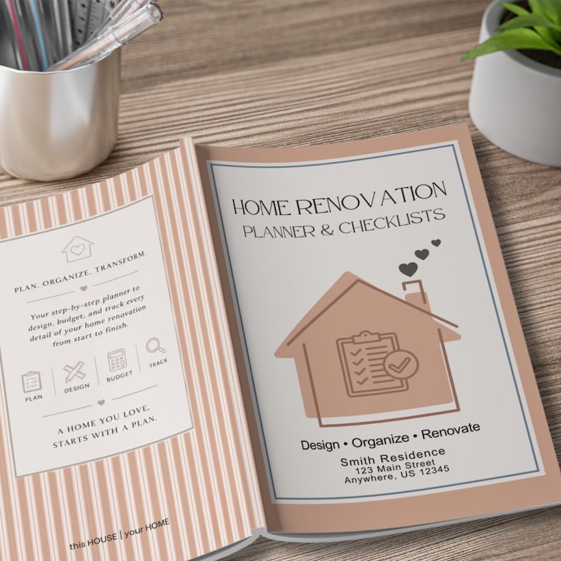 May include: Open home renovation planner and checklist. The cover features a house illustration with hearts and the text "Home Renovation Planner & Checklists." The planner includes sections for planning, design, budgeting, and tracking home projects. The planner is open on a wooden surface.
