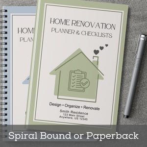 May include: Two spiral-bound home renovation planners with the text "HOME RENOVATION PLANNER & CHECKLISTS". The cover features a house graphic and the words "Design &bull; Organize &bull; Renovate". A silver pen rests beside the planners. The text "Spiral Bound or Paperback" is at the bottom.