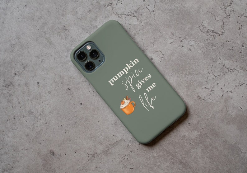 May include: A green phone case with a white design that says "pumpkin spice gives me life" and a cartoon image of a pumpkin spice latte.