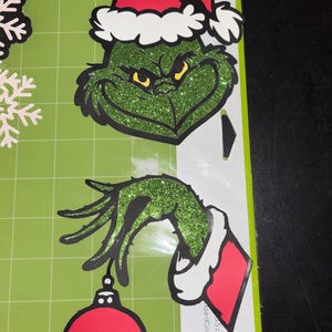 Grinch e mão com enfeites de topo, toppers, toppers de Natal, cartolina