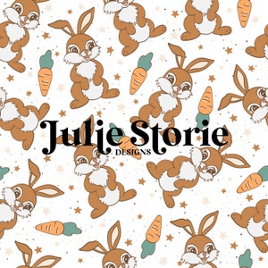 May include: A seamless pattern featuring brown bunnies with white fur and big eyes, holding carrots. The background is white with brown speckles and small stars. The text "Julie Storie Designs" is centered in the pattern.