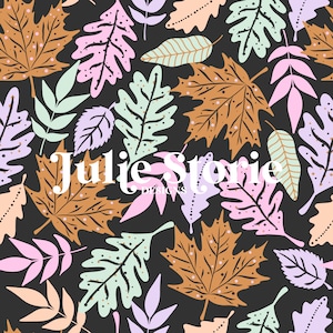May include: A seamless pattern featuring various colorful leaves in shades of pink, purple, green, and brown. The leaves are arranged in a random pattern on a black background. The text "Julie Storie Designs" is centered on the pattern.