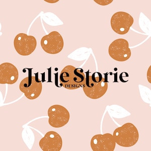 May include: A seamless pattern featuring brown cherries with white stems and leaves on a light pink background. The text "Julie Storie Designs" is centered on the pattern.