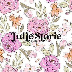 May include: A floral pattern featuring pink roses, tulips, and daffodils with green leaves on a white background. The design includes the text "Julie Storie DESIGNS" in black.