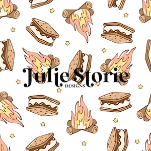 May include: A repeating pattern of camping-themed illustrations on a white background. The design includes s'mores, campfires, and stars in shades of brown, yellow, and pink. The text "Julie Storie DESIGNS" is also present.