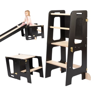 Toddlers tower transformed into table and a slide. Black and wood color.