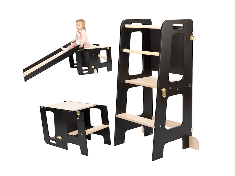 Toddlers tower transformed into table and a slide. Black and wood color.