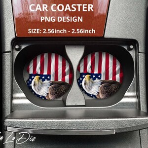 May include: Two round car coasters with a bald eagle and American flag design. The coasters are 2.56 inches in diameter and are shown in a car's cup holder.