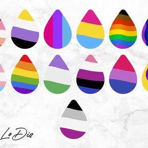 May include: A collection of 15 teardrop-shaped stickers featuring various pride flags, including the transgender, lesbian, gay, bisexual, pansexual, asexual, intersex, and genderfluid flags. The stickers are arranged in a grid pattern on a white marble background.