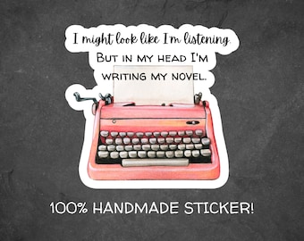 May include: A pink typewriter sticker with the text "I might look like I'm listening. But in my head I'm writing my novel." and "100% HANDMADE STICKER!"