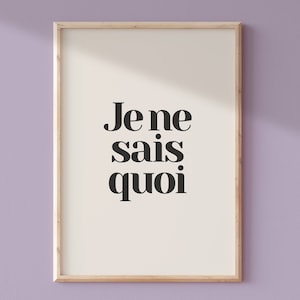 May include: A framed print with the French phrase "Je ne sais quoi" in black text on a white background.