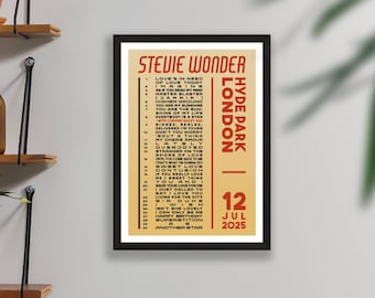 May include: Framed concert poster for Stevie Wonder's Hyde Park, London show on July 12, 2025. The poster features a cream-colored background with red text listing song titles and event details. The poster is in a black frame.