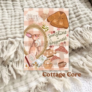 May include: A cottagecore aesthetic digital art print featuring a pink and white checkered background with a brown rabbit, a brown cardigan, mushrooms, a book, and the text "Just one more chapter" and "Sunshine & happiness".