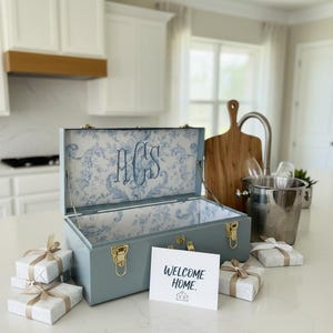 May include: A rustic wooden sign with the text "Welcome to our porch" in white lettering. The sign features a distressed finish and a simple, inviting design, perfect for outdoor decor.