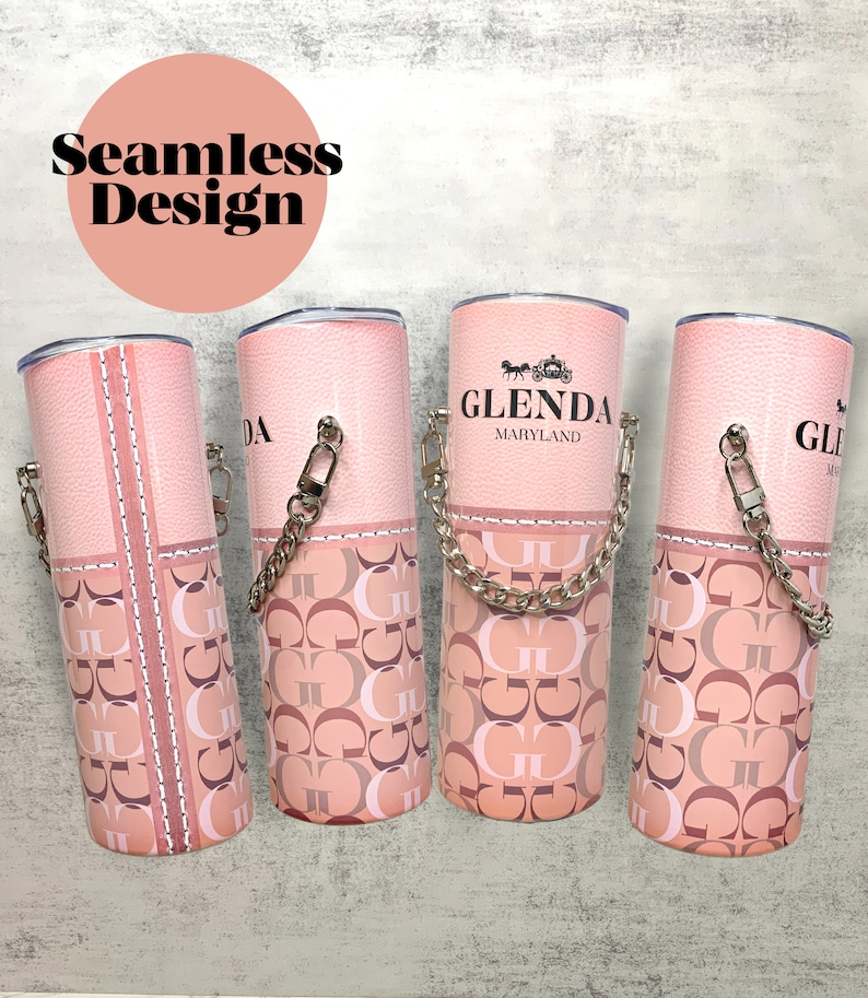 May include: Four pink tumblers with a chain handle and a pink and brown patterned design. The tumblers have the text "Glenda Maryland" on one of them.