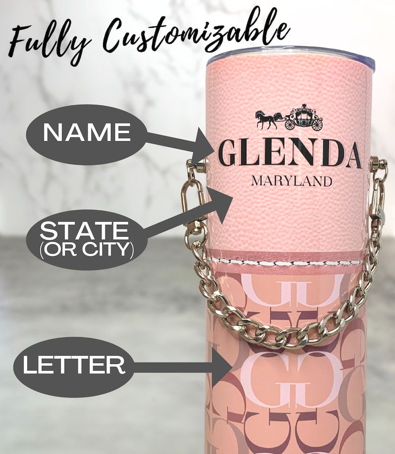 May include: A pink tumbler with a silver chain handle. The tumbler has a white stitched line around the top and a pattern of pink and brown letters. The tumbler is personalised with the name "GLENDA" and the state "MARYLAND".