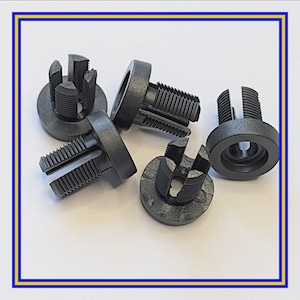 May include: A collection of black plastic fasteners with threaded shafts and slotted heads. The fasteners have a circular base and are designed for secure attachment. The image is set against a white background.