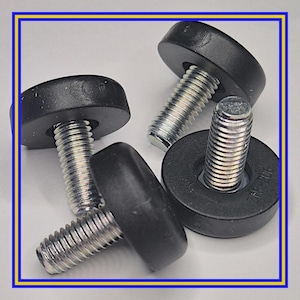 May include: Four black furniture levelling feet with silver threaded bolts. The feet have a rounded, flat top and are designed to adjust the height of furniture. The bolts are made of metal and screw into the furniture.