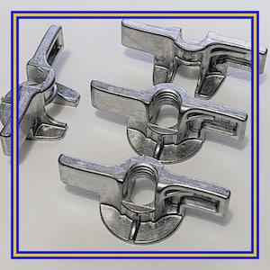 May include: A collection of silver-colored wing nuts, designed for secure fastening. Each nut features a central threaded hole and two wing-shaped extensions for easy tightening by hand. The nuts are made of a durable metal.