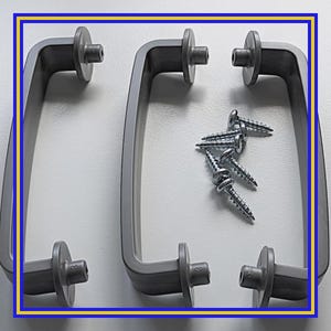 May include: Four silver-gray cabinet handles with matching screws. The handles have a curved design and are mounted on a white surface. The screws are silver and have a pointed end.