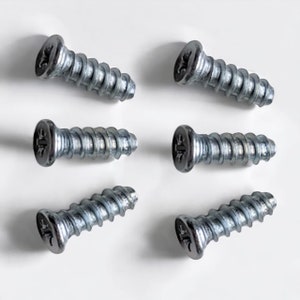 May include: Six silver screws with a Phillips head. The screws are all the same size and have a slightly rounded head.
