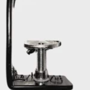 May include: A black metal C-clamp with a threaded adjustment screw and a handle. The clamp has a rectangular base and a curved top arm. The screw is silver-coloured, and the handle is horizontal.