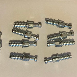 May include: Ten silver metal screws with a threaded shaft and a round head. The screws are designed for use in wood.
